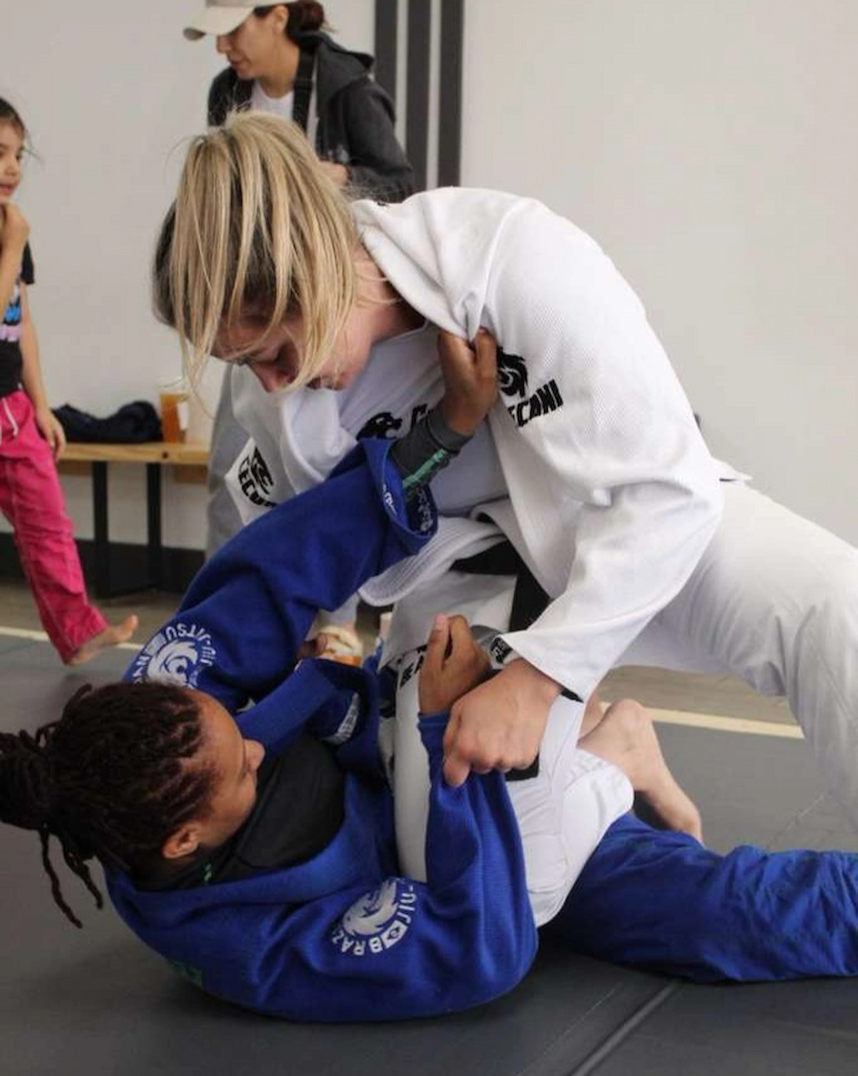 Experienced Ceconi BJJ Cypress students practicing Brazilian Jiu-Jitsu on the mats